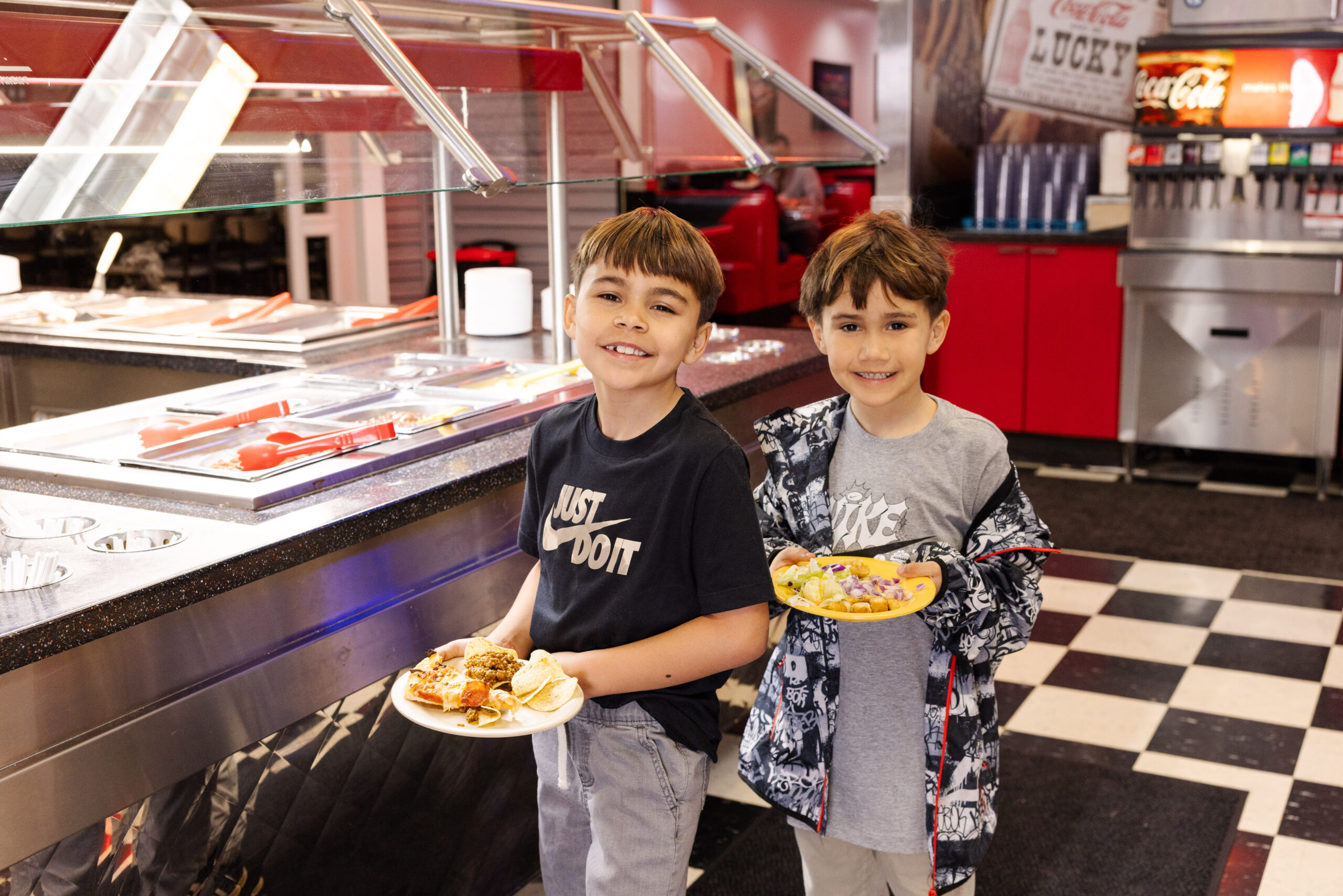 Kid holding food at Incredible Food & Fun
