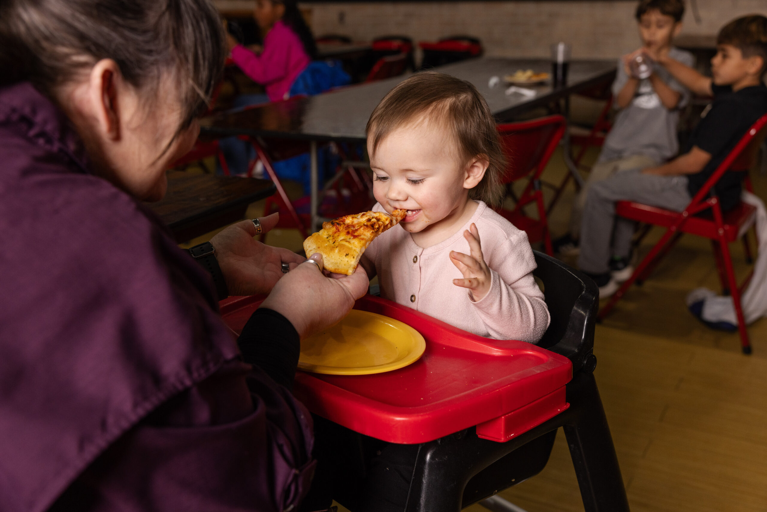 Family dining moment with pizza at Incredible Food and Fun