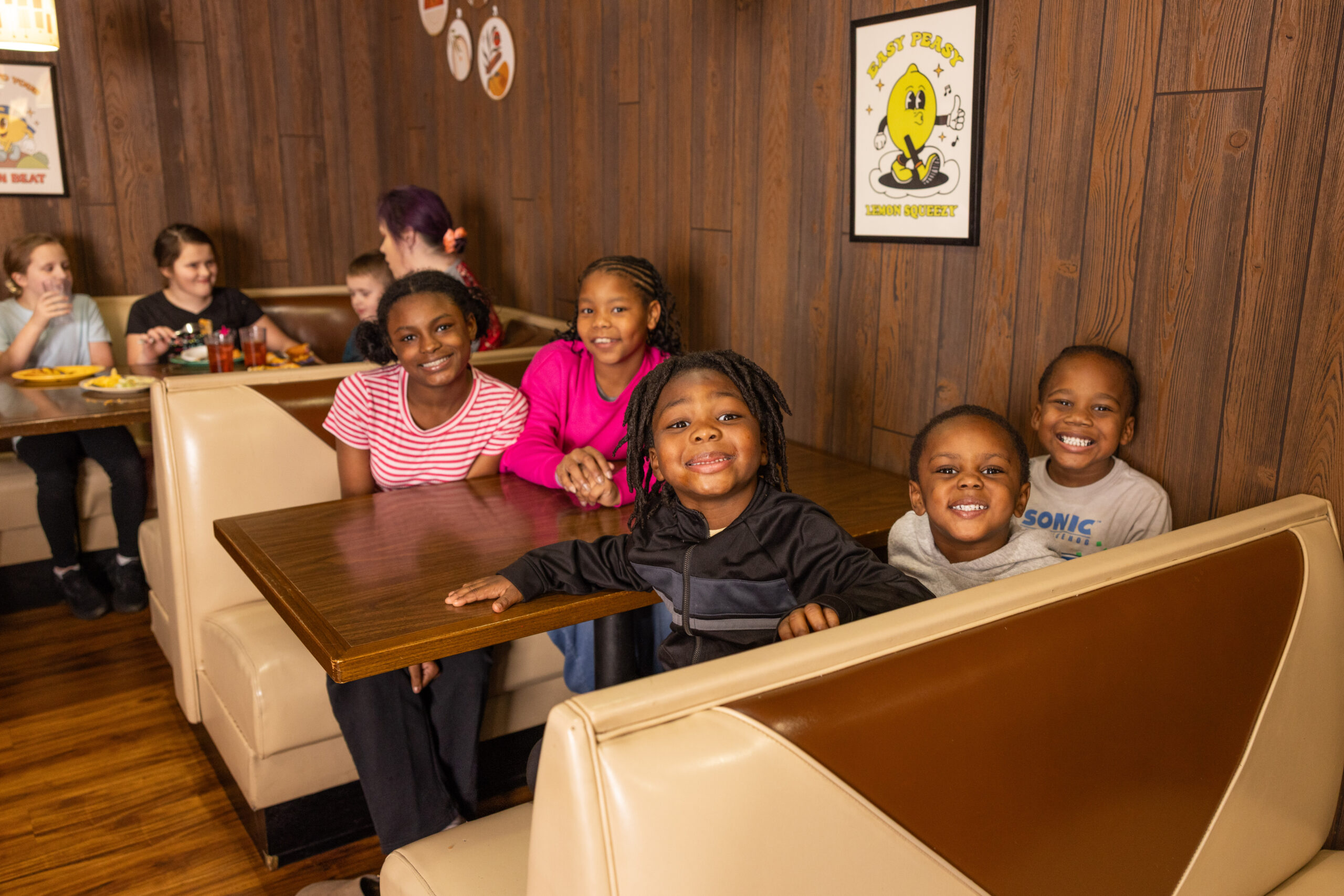 Kids gathered around a table at Incredible Food & Fun