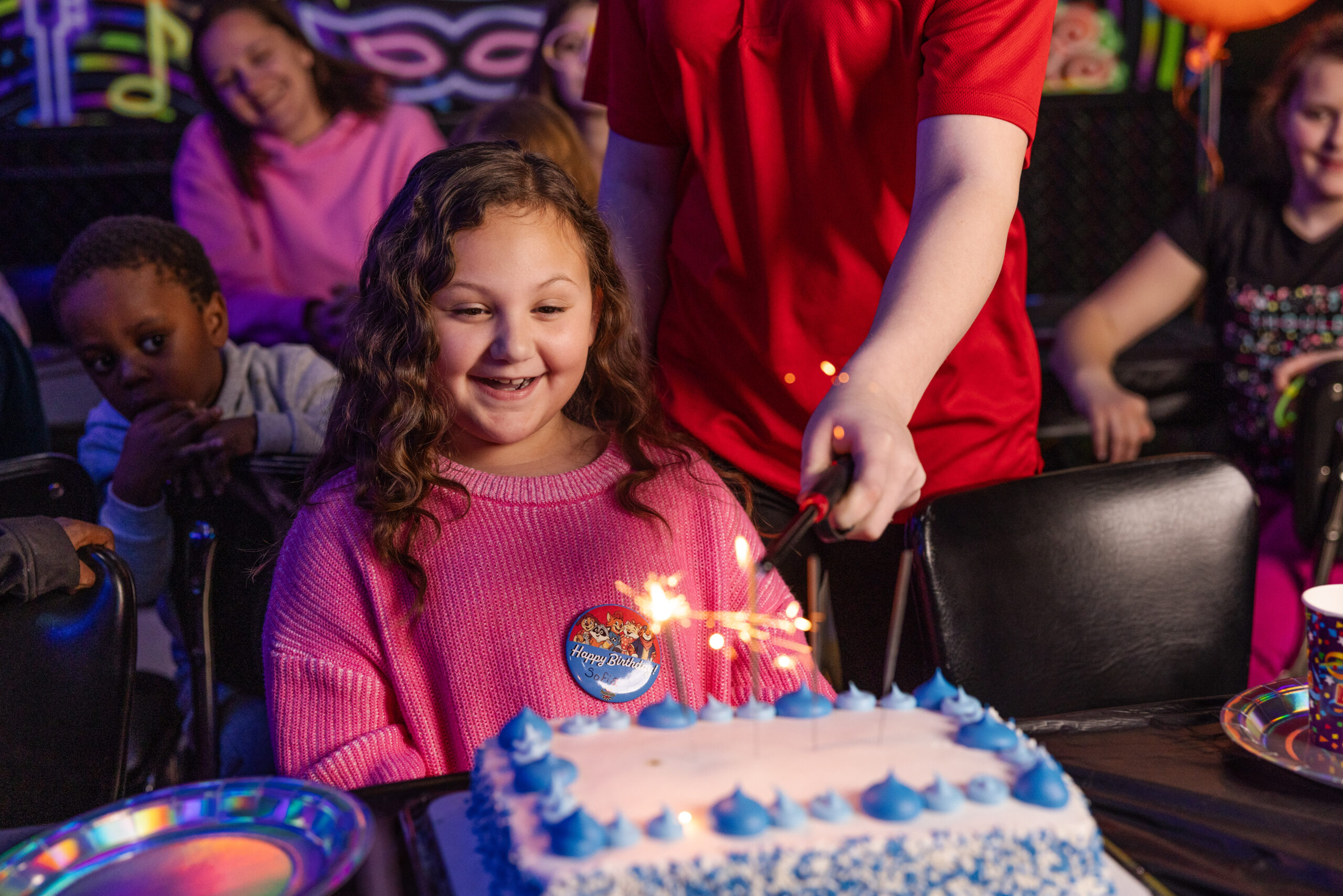 Birthday party hero moment with guests enjoying celebration
