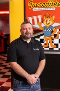 Ryan Tiffin VP of Brand Strategy and Guest Experience at Incredible Food and Fun inside entertainment venue