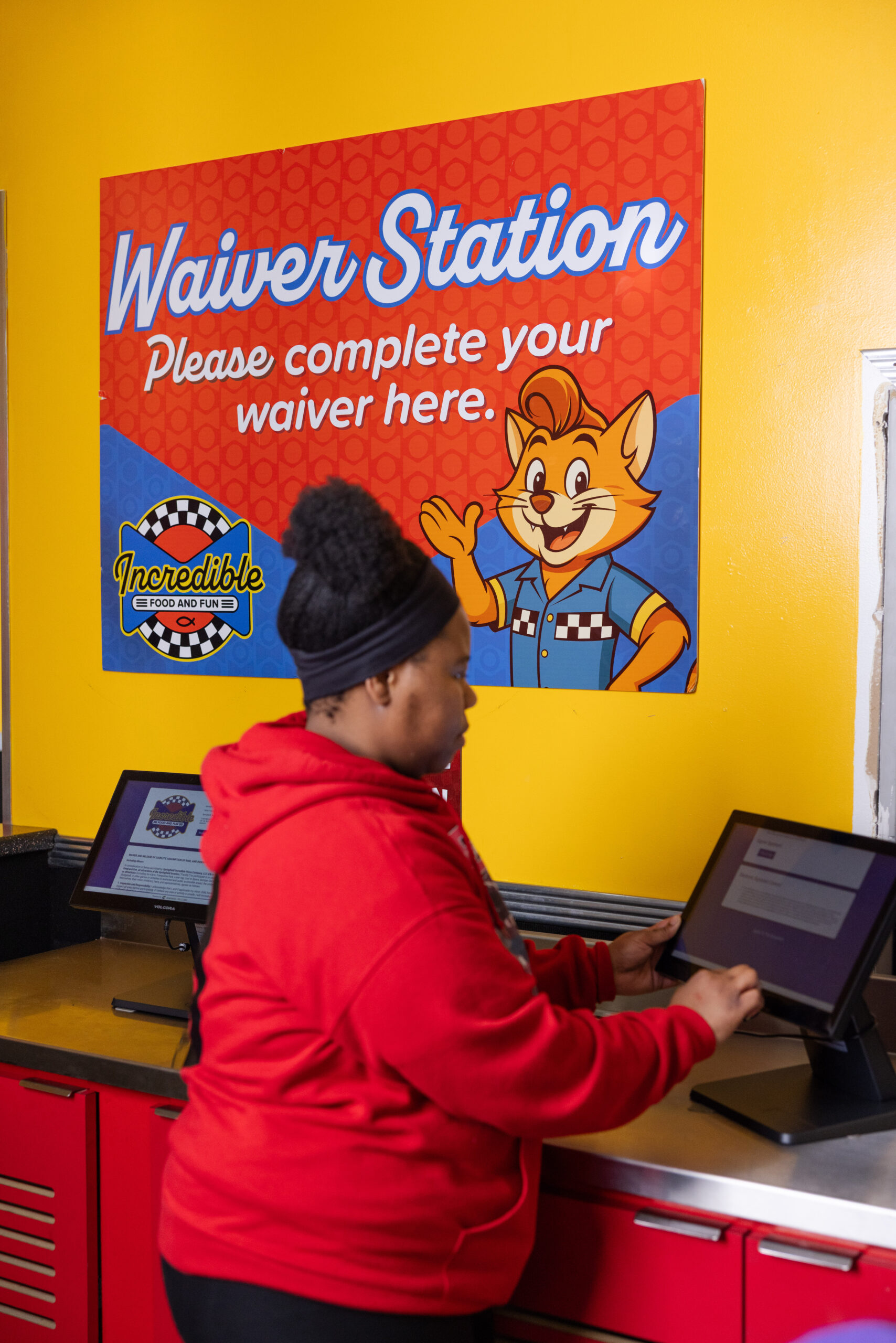 Guest filling out waiver before visiting Incredible Food & Fun